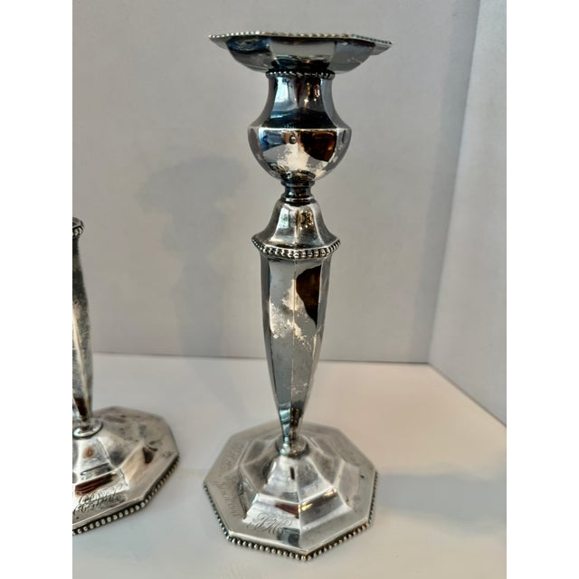 Pair of Unweighted Candlesticks by Woodside Sterling Co. (active c. 1895–1960s), an American silversmith active in New...