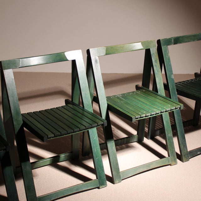 Description an exceptional group of design classics. The „trieste“ folding chairs, designed by aldo jacober and produced...