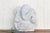 Finely carved from pure marble, this lovely Ganesh statue is known as the remover of obstacles. Shown as a modern semi...
