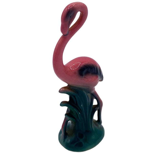 Mid-century pink and green ceramic flamingo statue set by Leftons. The set features two beautifully detailed pink...