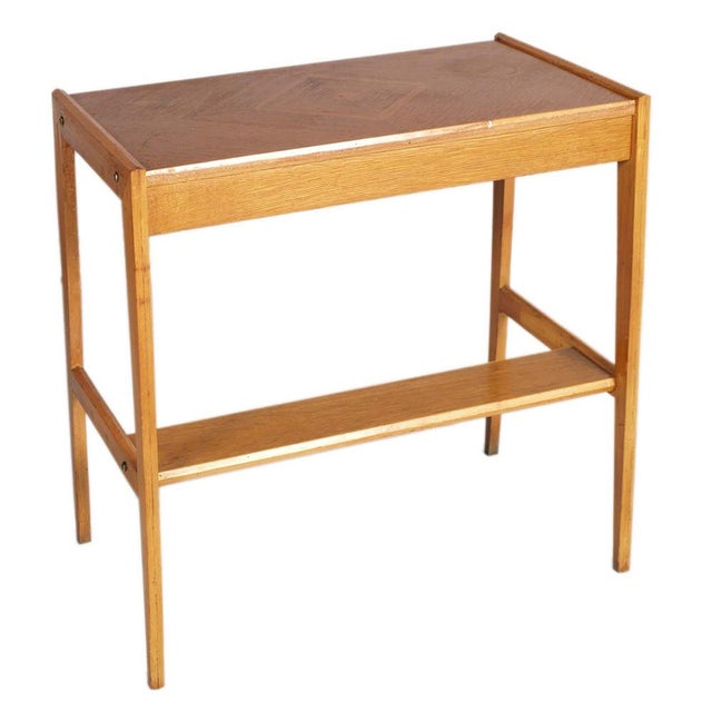 An elegant and minimalist wooden vanity desk typical of 1940s Italian design. The top features a refined herringbone...