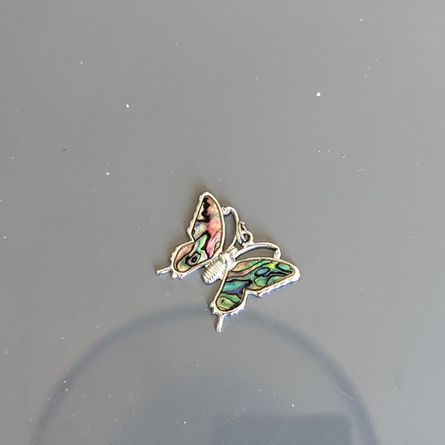 The holloware version of the abalone butterfly, meaning its lighter in weight and made of a metal other than silver,...