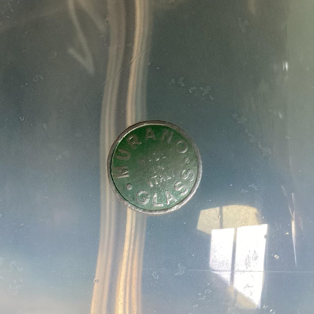 A refined pair of hand-blown Murano glass table lamps, made in Italy and marked. Each lamp features an elegant elongated...