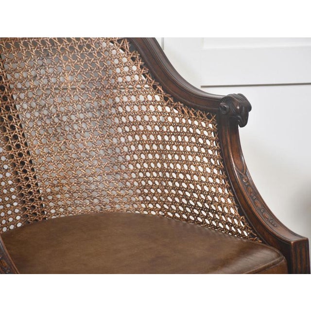 This elegant pair of mahogany library chairs showcases the refined craftsmanship and classical revival style popular in...