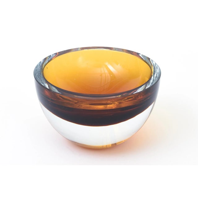 This vintage signed Murano sommerso chunky glass bowl is amber, brown to clear at the bottom. It is thick walled. From the...