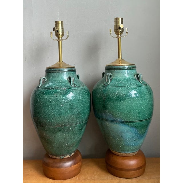 Offered as a pair, these vintage table lamps combine urn-shaped ceramic bodies with a vibrant speckled green glaze. Small...