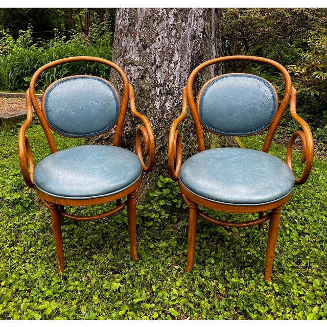 Gorgeous pair of bentwood Thonet Style upholstered armchairs. Blue upholstery is either leather or high quality vinyl in a...