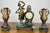 A beautiful Vintage French garniture set featuring an ornate marble clock accompanied by matching decorative side...