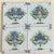 A timeless set of four (4) 19th-century Dutch Delft tiles with unique variations of fruit baskets that include grapes,...