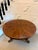 An antique Regency figured mahogany circular tilt-top dining and centre table with a striking segmented top, unusual...