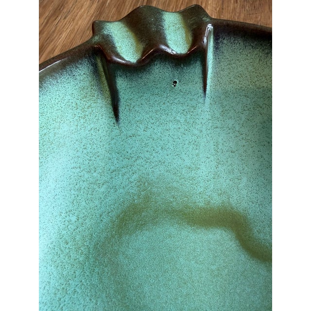 This is a vintage Frankoma pottery ashtray in the Prairie Green color, associated with their Plainsman line. It is a...