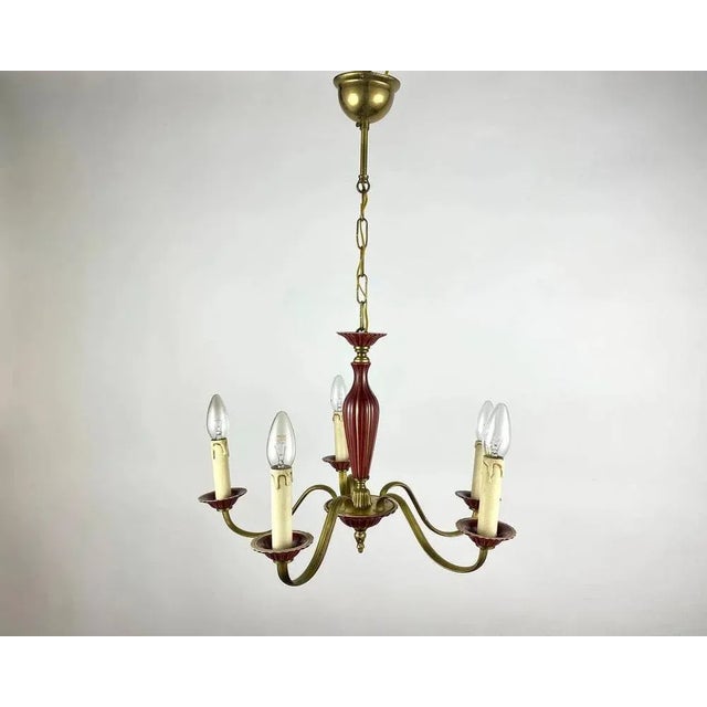 Vintage chandelier for 5 horns in burgundy ceramic & polished gilded brass fittings. the base is made of impeccable gold-...