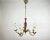 Vintage chandelier for 5 horns in burgundy ceramic & polished gilded brass fittings. the base is made of impeccable gold-...