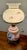 This lamp functions as a decorative and functional lighting piece, providing ambient illumination with multiple three way...