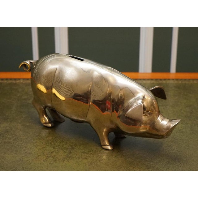 We are delighted to offer for sale this Lovely 1920s Antique Brass Piggy Bank. The piggy bank would resemble an actual pig...