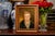 his portrait presents a dignified, almost understated depiction of a woman whose gaze meets the viewer directly, evoking a...