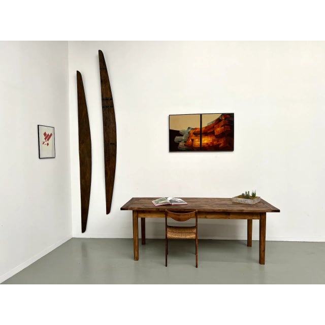 Maison Lecan presents this large pine table, a unique piece made in the 1970s. Its thick solid pine top, with a slightly...