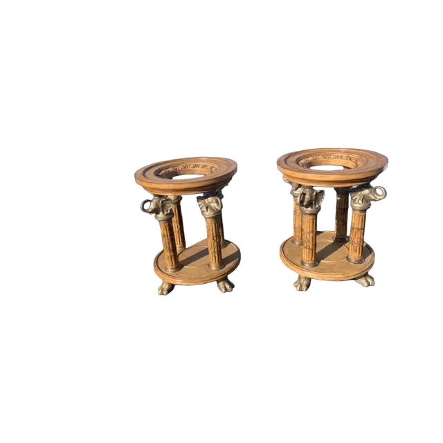 Pair of round dining room table pedestal with elephant heads and feets. They have rattan and the bottom and leather straps...