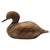 This minimalist hand-carved duck sculpture is executed from a single, dense block of solid hardwood, emphasizing mass,...
