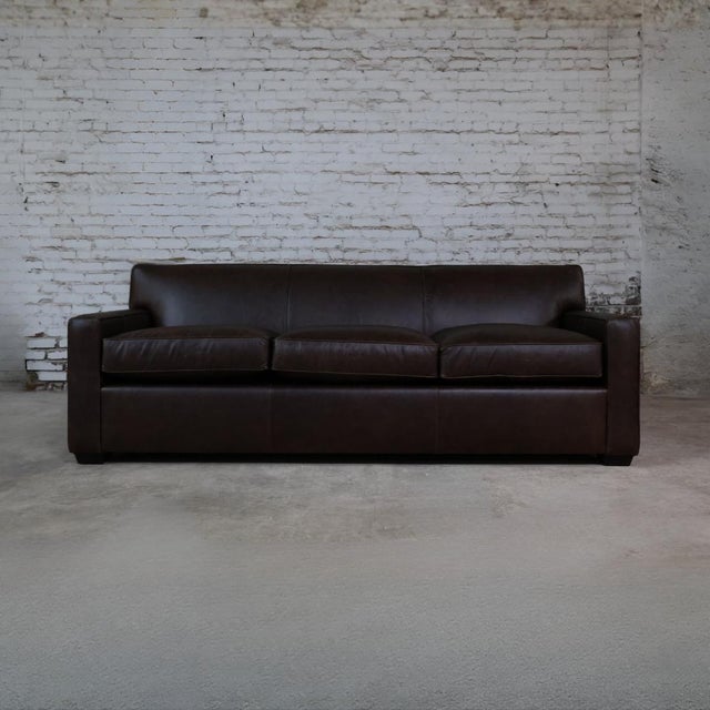 The Theodore Leather Sofa by Little House, Christopher Collection’s private label, is distinguished by its tailored form...