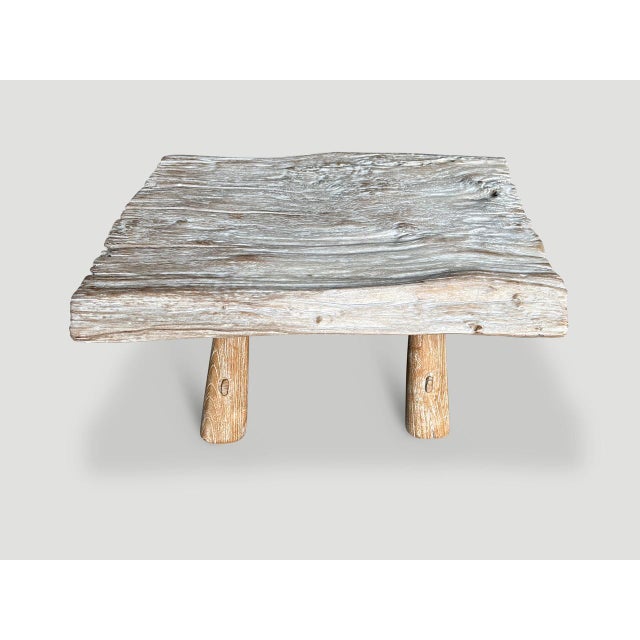 Impressive single slab coffee table made from century year old teak wood with rare erosion detail on the ends. We added a...