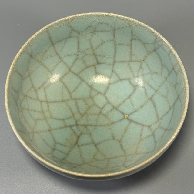 Fine antique Chinese celadon bowl. Deep rounded form fully covered in beautiful natural crackled celadon glaze. This is a...