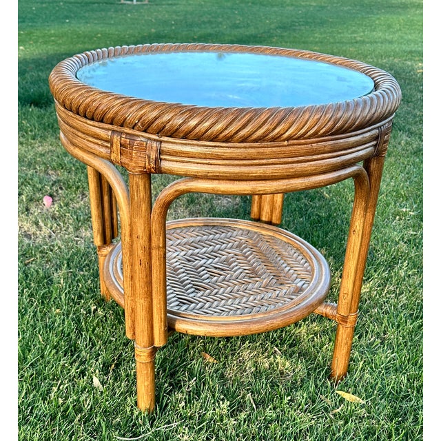 1970s Boho Chic Rattan Table Set Includes: (2) End Tables 22" D x 22" H (1) Coffee Table 33" D x 19" H Add a coastal flair...