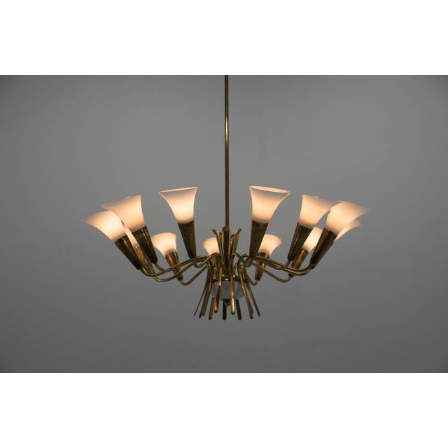 This extraordinary mid-century modern chandelier is a rare piece of design history, specifically designed and executed by...