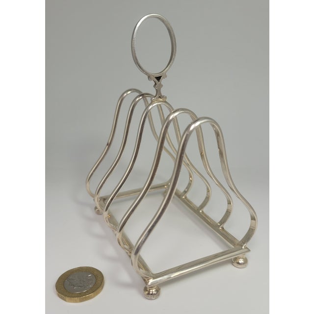 This gorgeous sheffield sterling silver toast tack is a charming piece of english Edwardian breakfast tableware. Circa...