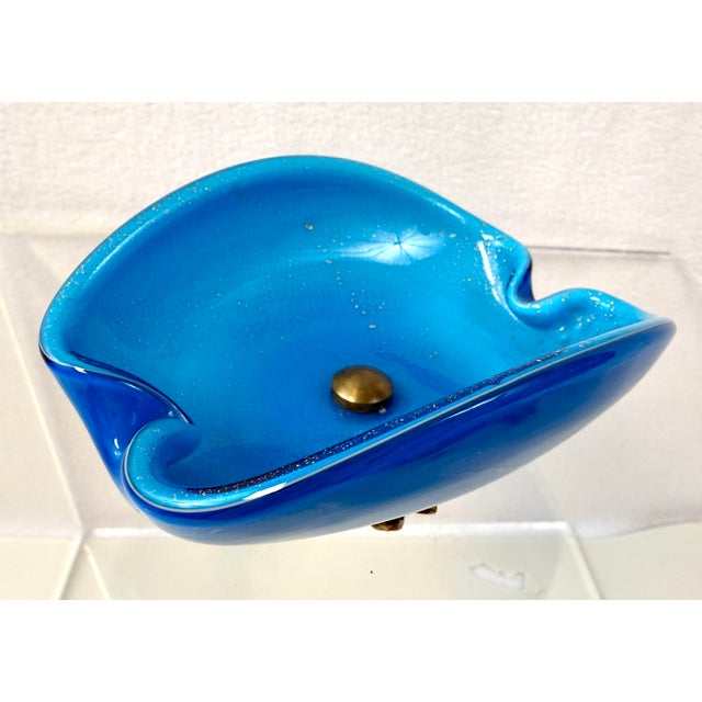 Stunning 1950s mid-century deep dreamy blue bi-fold clamshell Murano glass with aventurine gold flex inclusions. The...
