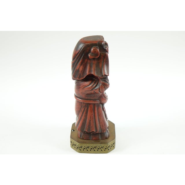 Antique Chinese Wood Carving of a Man on Brass Stand - 6.25” x 6.25” x 15” This exquisite antique Chinese wood carving,...
