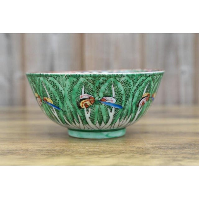 A charming antique Chinese porcelain bowl dating to the late Qing dynasty, circa 1850–1899, decorated with the distinctive...