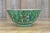 A charming antique Chinese porcelain bowl dating to the late Qing dynasty, circa 1850–1899, decorated with the distinctive...