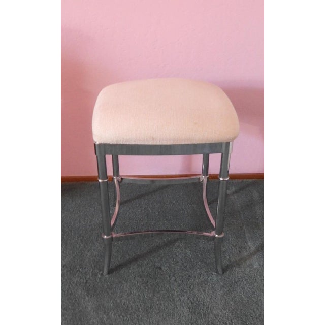 This marvelous later 20th Century vanity stool or bench is created in gorgeous silver chrome with faux bamboo ring...