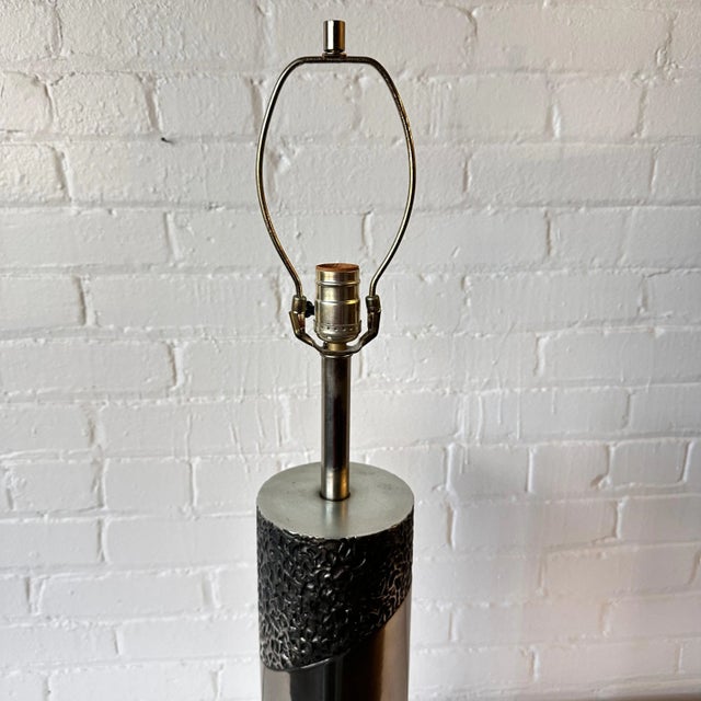 Modernist Richard Barr cast metal brutalist table lamp will provide an edgy and artful addition to any room. It features a...