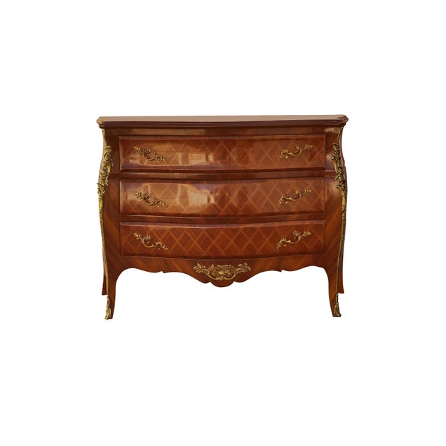 This is a beautiful reproduction piece of a French Louis style antique commode or chest of drawers (or dresser), with a...