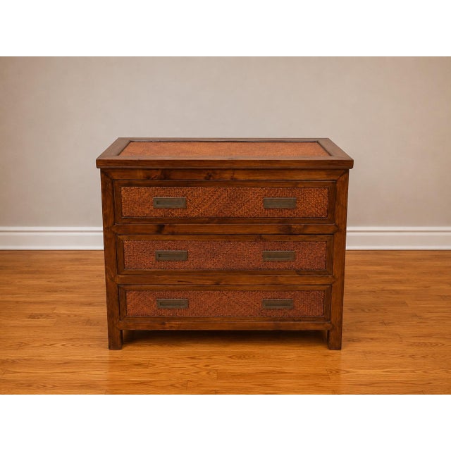 An exceptional pair of vintage Palecek woven rattan accent chests featuring richly textured woven drawer fronts, inset...