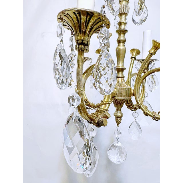 Restores bronze Spanish chandelier with decorative frame, decorative trombone arms and 30% leaded Swedish cut crystal...