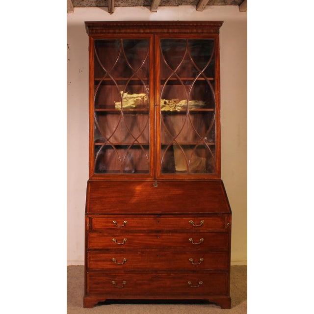 A very fine late 18th-century mahogany secretary desk in the Georgian style. This beautiful secretary desk features four...