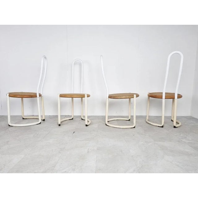 Italian metal postmodern or Bauhaus inspired design dining chairs with white lacquered metal tubular frames and beech wood...