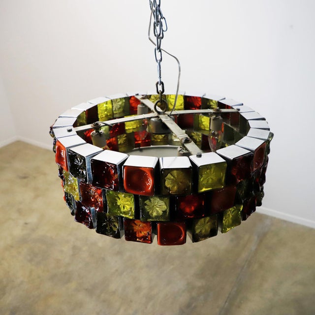 We offer this pair of big size chandeliers, made of steel and multicolored blown glass in fantastic vintage conditions,...