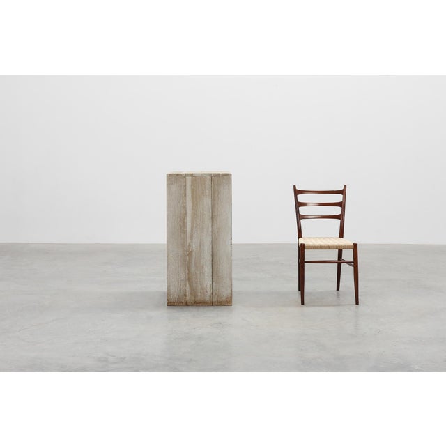 A minimalist late‑20th‑century Belgian pedestal crafted entirely from solid oak, showcasing clean lines, natural texture,...