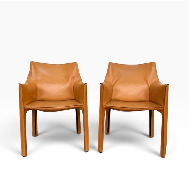 Pair Mario Bellini "CAB 413" Dining Chairs for Cassina Camel Leather c. 1970 Measure 31” tall 22” wide 18” deep seat...
