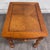 This is a traditional Broyhill wood end table featuring a warm brown finish, decorative fluted and turned legs, bun feet,...
