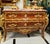 A true masterpiece of French-inspired luxury, this stunning Louis XV Bombe Commode showcases an elegant serpentine...