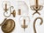 This gold wall sconce features a bubbled glass shade and decorative clear beads wrapped around the metal arm and base,...