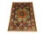 This naturally dyed wool rug features a Mamluk-inspired design in warm orange, teal, navy, and ivory. A dark central...