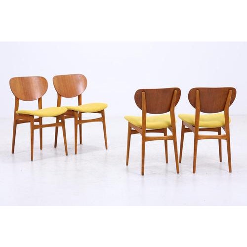 Beautiful set of four vintage teak chairs from the 1960s with a clean, sleek form and understated Danish lines. The teak...