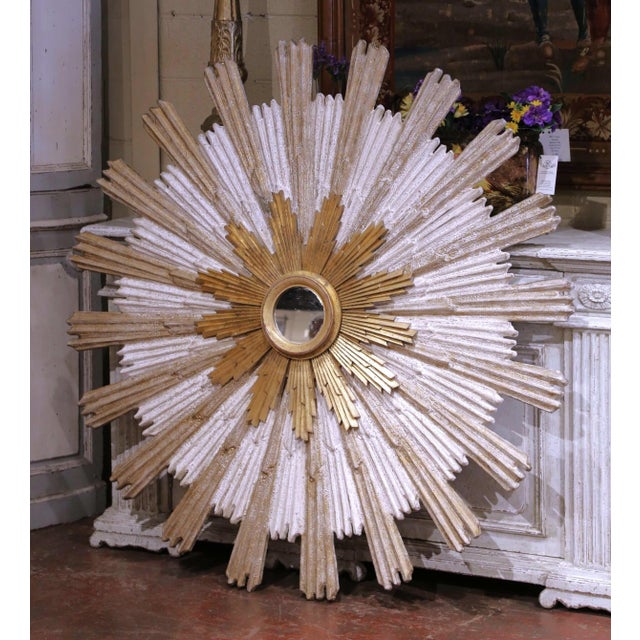 Add luminous presence and sculptural elegance to any interior with this monumental Italian sunburst mirror, crafted circa...