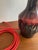 A striking ceramic table lamp by ernst nielsen for ernst faxe keramik, denmark. The deep oxblood glaze — running from...